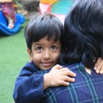 Child hugging mother , bye time