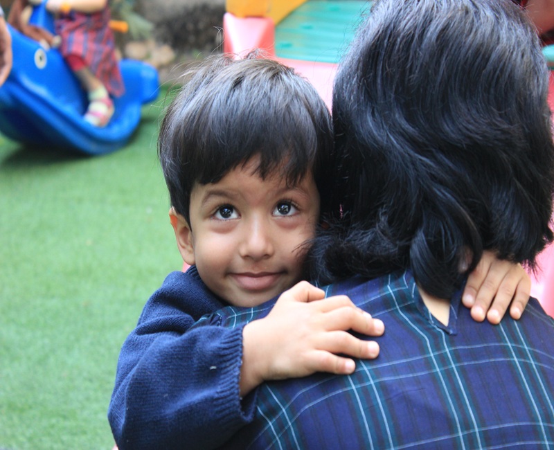 Child hugging mother , bye time